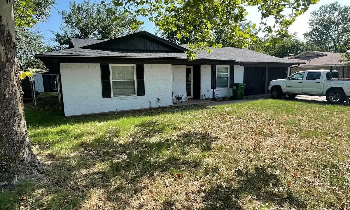 Professional roofing crew working on a residential roof in Harrisonburg